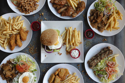 Top view of different street food dishes, variety of dishes of pakistani origin.