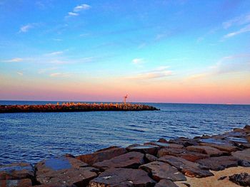 Scenic view of sea at sunset