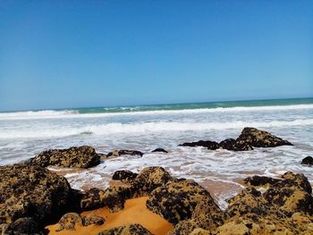 Scenic view of sea against clear sky