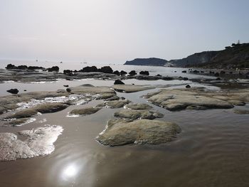 Scenic view of beach against clear sky