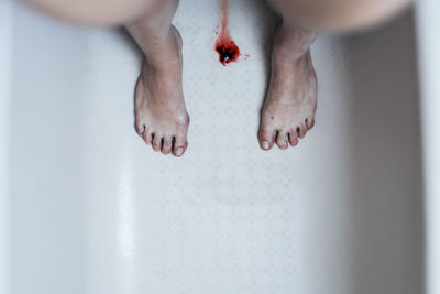 Low section of woman legs in water