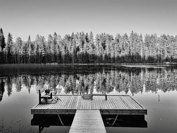 Pier on lake against sky