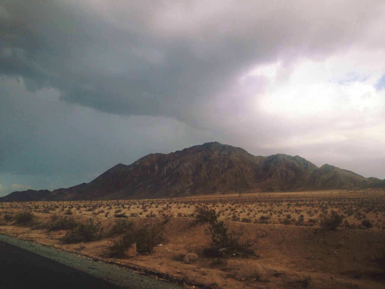 sky, landscape, cloud - sky, mountain, tranquil scene, cloudy, tranquility, scenics, cloud, nature, beauty in nature, horizon over land, non-urban scene, mountain range, remote, field, overcast, hill, day, desert