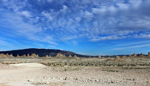 Scenic view of landscape against blue sky