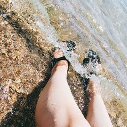 Low section of person legs in water