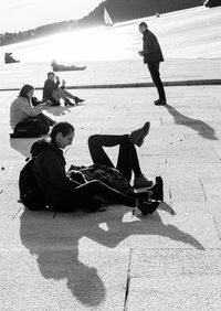 Shadow of man sitting on beach