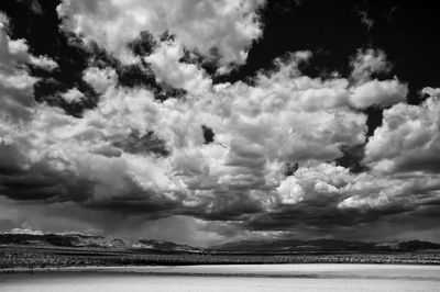 Scenic view of sea against cloudy sky