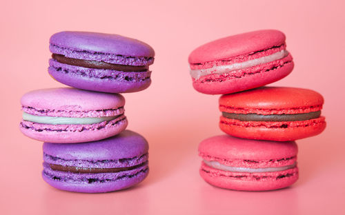 Close-up of cupcakes against colored background