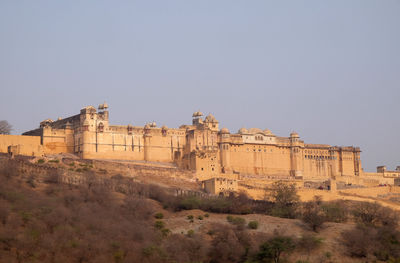 Low angle view of old ruins against clear sky