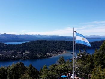 Scenic view of mountains against blue sky