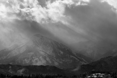 View of mountain range against cloudy sky