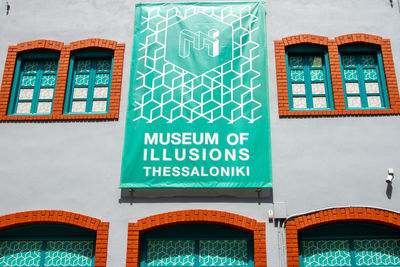 Low angle view of text on building