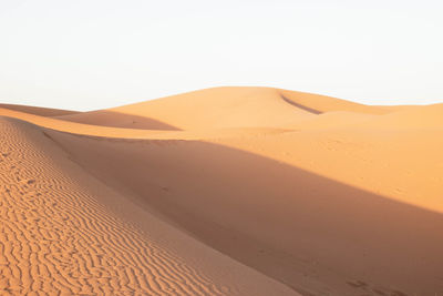 Scenic view of desert against clear sky