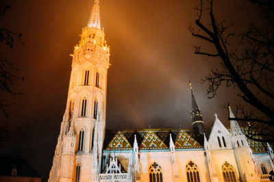Low angle view of bell tower at night