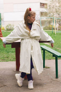 Rear view of girl standing outdoors