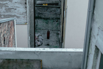 Abandoned building seen through window