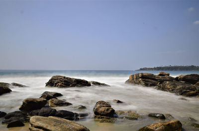 Scenic view of sea against clear sky