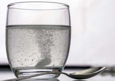 Close-up of beer glass on table