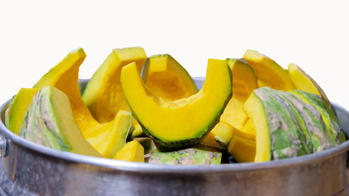 Close-up of fruits in glass bowl on table