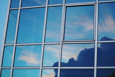 Low angle view of sky seen through glass window