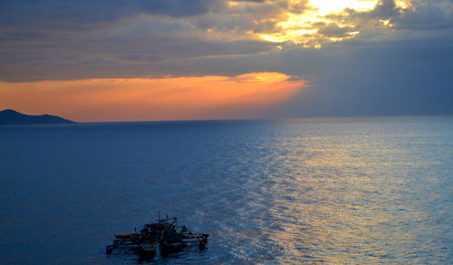 Scenic view of sea at sunset