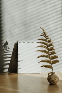 Close-up of leaves in vase on table