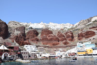 Scenic view of buildings against clear blue sky