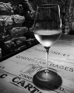 Close-up of wine glasses on table