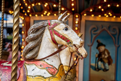 View of carousel horse in amusement park