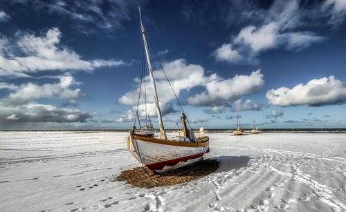 Fishing boat at slettestrand beach in denmark in the winter time.