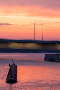 Scenic view of sea against orange sky