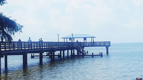 Pier over sea against sky