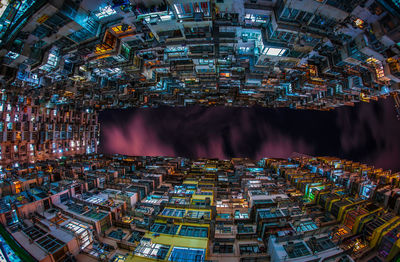 Aerial view of illuminated buildings in city at night