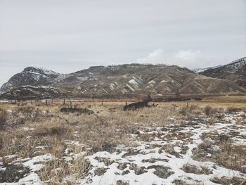 Scenic view of snowcapped mountains against sky