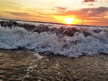 Scenic view of sea at sunset