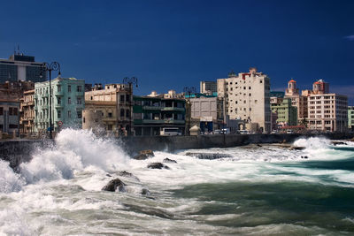 Scenic view of sea against clear blue sky