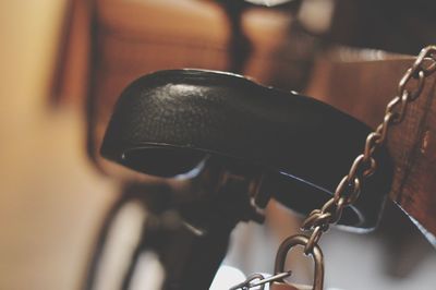 Close-up of camera hanging on metal chain