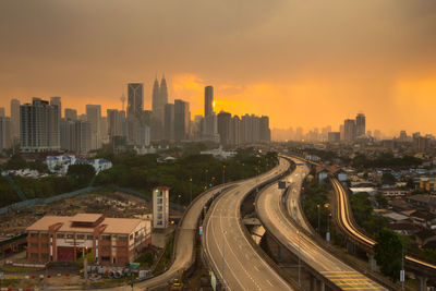 High angle view of city at sunset