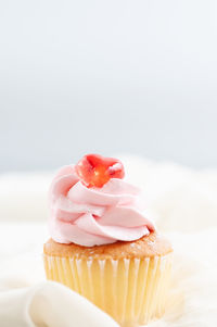 Close-up of cupcakes against white background