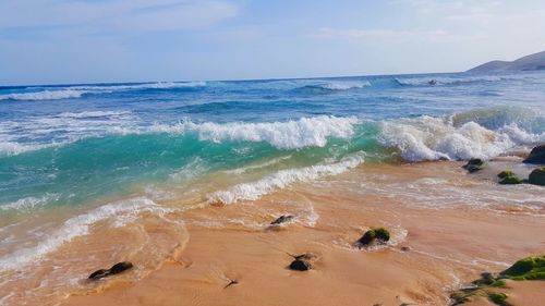 Scenic view of beach against sky