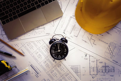 High angle view of clock on table