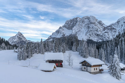 Snowcapped mountains against sky during winter