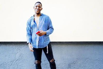 Young black man using his smartphone