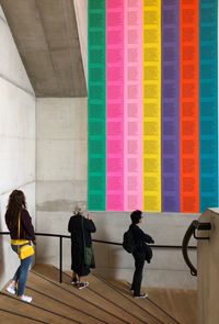 Rear view of people walking in corridor