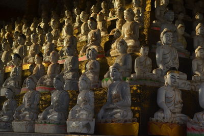 Statue of statues in temple outside building