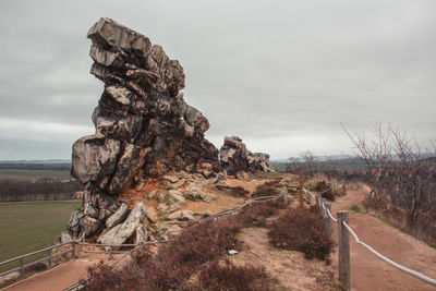 Rock formation on land against sky