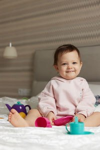 Portrait of boy playing with toy blocks at home