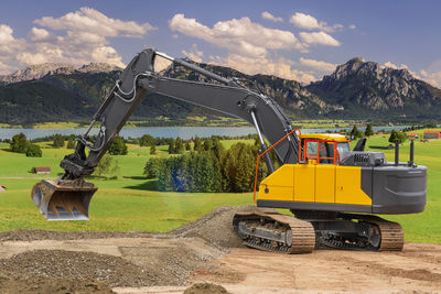 Heavy earth mover bulldozer working on construction site