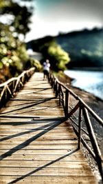 Wooden footbridge over river