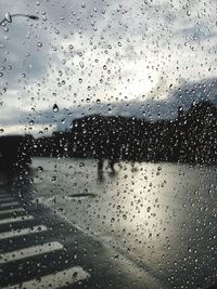 Full frame shot of wet glass window in rainy season